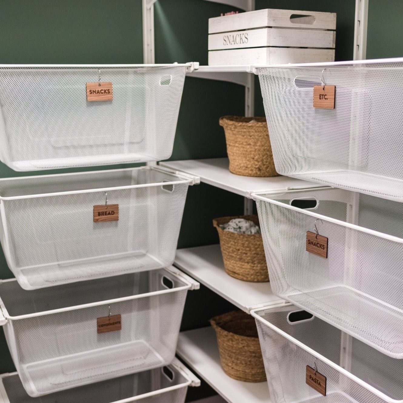 Hooked Labels for Storage Bin Organization - Walnut Wood Pantry Clean Font hanging from white baskets - by LeeMo Designs in Bend, Oregon