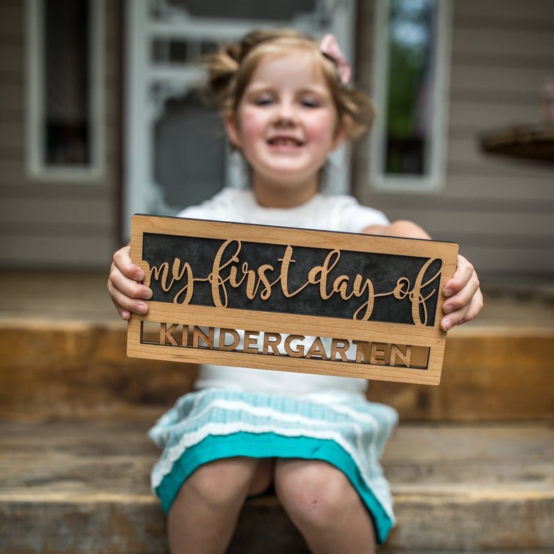 Reversible first day last day of school wood sign in script style with interchangeable grade inserts, reusable from preschool through high school for milestone photos.